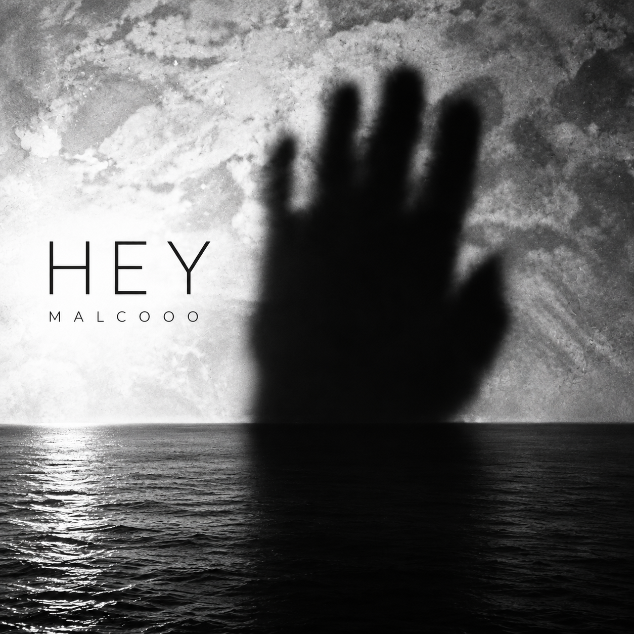HEY by MALCOOO — shadowy hand over the sea, black-and-white cover artwork